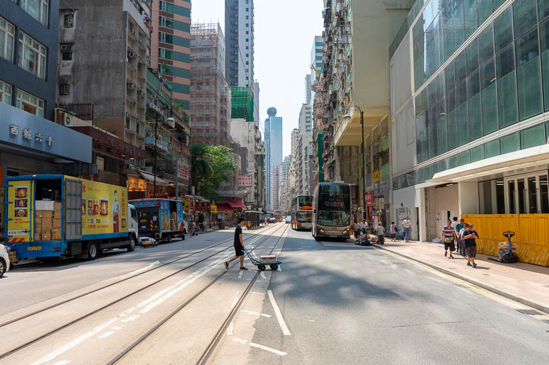 Korea - HK - China - KORKONG! - And here is one last photo of a typical Hong Kong street, featuring guy with delivery trolley. All the guys pushing these aim them at my shins.
