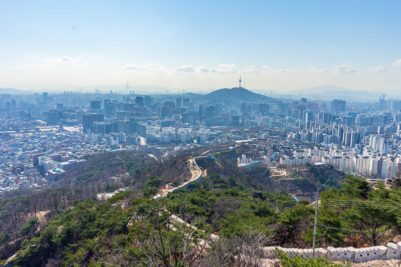 Korea-Seoul-Hiking-Inwangsan - Great view of the city, and more wall, and the Seoul tower where I was last night. There is actually an ancient city wall under this new wall, and it 