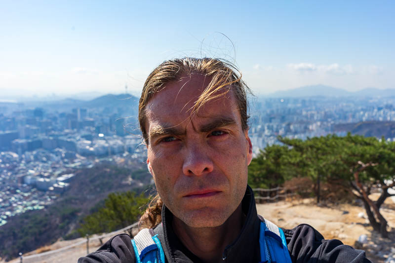 Korea-Seoul-Hiking-Inwangsan - I decided now was an opportunity to stick my big ugly head in the frame, hair blowing across my face, nostrils flaring. My nostrils are pre flared at 