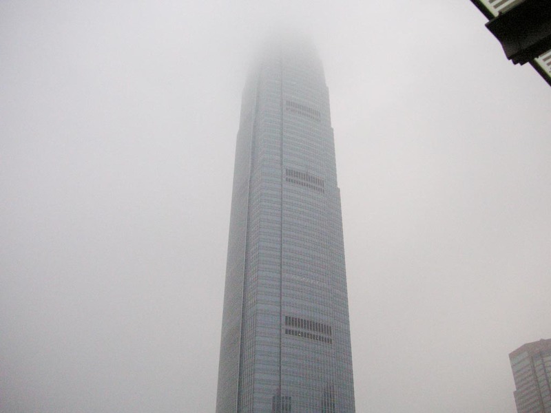Hong Kong-Star Ferry-Smog-Tsim Sha Tsui - IFC 1 ascends into the smog.
