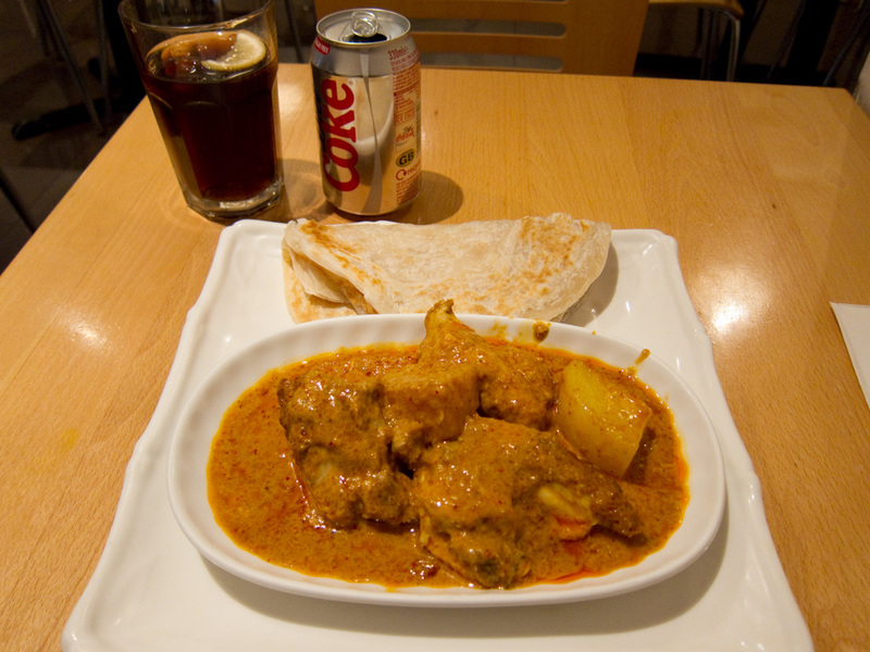 England-London-Camden - Heres my dinner from a Singaporean curry house (in China town). It was pretty great, and cost about $10, quite spicy, good roti. When I got there a gr