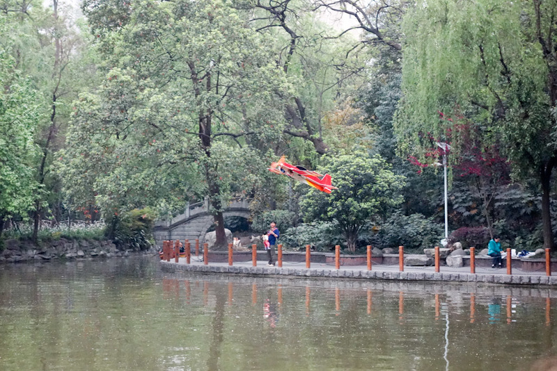 China-Chengdu-Jinli-Shopping Street-Peoples Park - Then I couldnt believe my eyes, this radio controlled lightweight plane was pulling off the most amazing stunts. I had never seen anything like it, lo