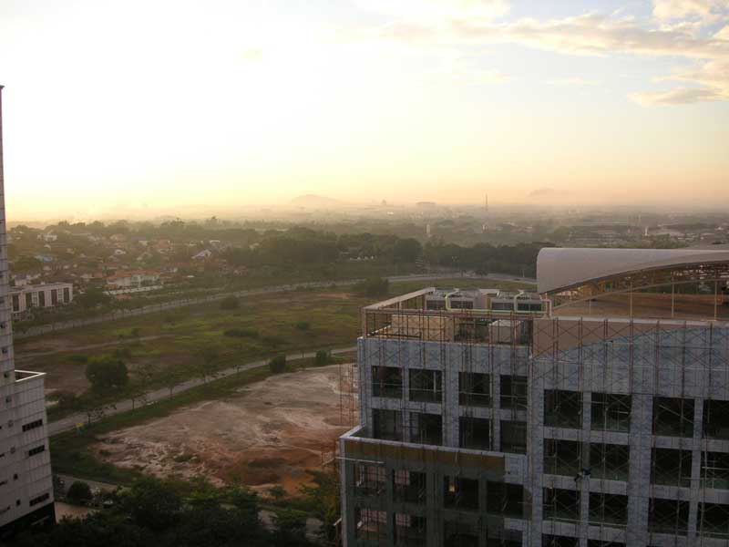 Malaysia-Shah Alam-Mosque - View from the hotel room window, fog on the distant mountains.