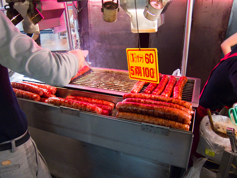Taiwan-Taipei-Night Market-Shilin - These sausages are at least a foot long and as thick as my puny girl arms. Who could chomp on one of those? I chickened out not because it looked horr