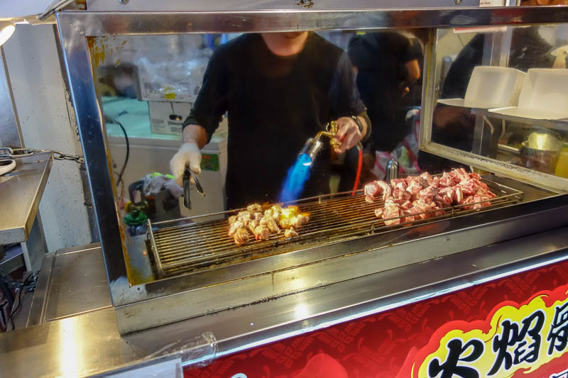 Taiwan-Taipei-Ximending-Ramen - Blow torch beef is back! Its small cubes now in a box, not as good as the time I saw a whole steak get blow torched and shoved in a paper bag.