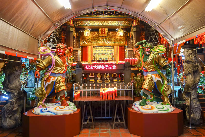 Taiwan-Taipei-Ximending-Ramen - This temple has LED scrolling screens, as many do, an ATM, as many do, and a new addition, god like warriors that shoot lasers from their eyes.