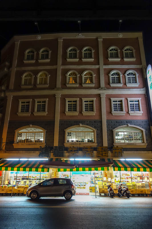 A full lap of Taiwan in March 2017 - This is quite a nice supermarket on the ground floor in a nice building. A bit hard to see in the darkness, looks kind of French.