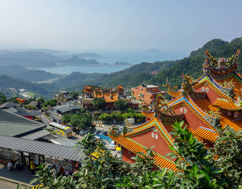 Taiwan-Jiufen-Hiking-Teapot Mountain - One last photo of the view, this time with temples and an island. On a clear day it would be awesome.